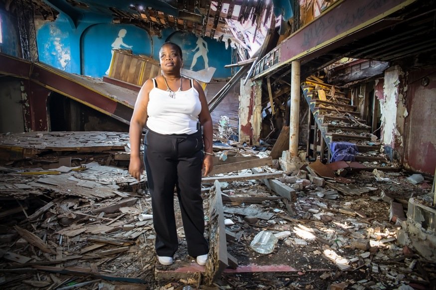 Marguerite Johnston in a destroyed Club Desire in New Orleans' Upper 9th Ward.