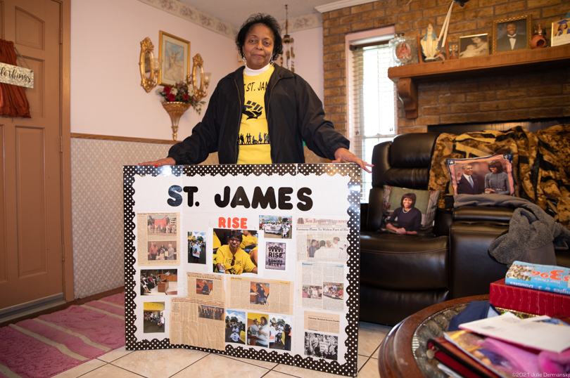 Sharon Lavigne with a display of photos from her ongoing fight against the encroaching petrochemical industry in St. James.