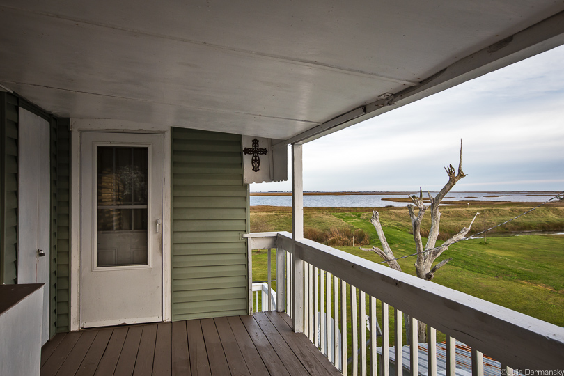 View of the water and marshes from a raised home on Isle de Jean Charles.