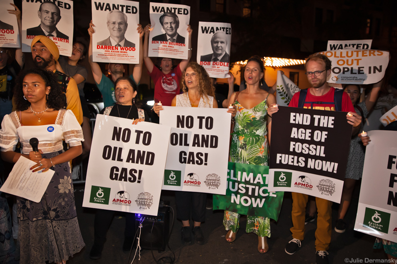 Climate justice activists protest outside the Oil and Gas Climate Initiative event 