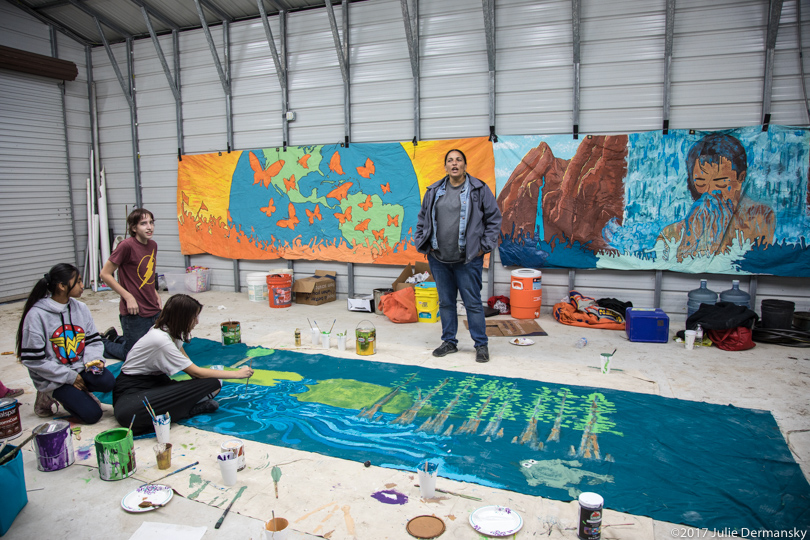 Cheri Foytlin looks over people painting anti-pipeline resistance art murals