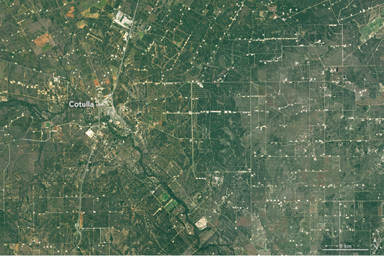 The pads for oil and gas wells are evident in a satellite view of La Salle County, Texas.