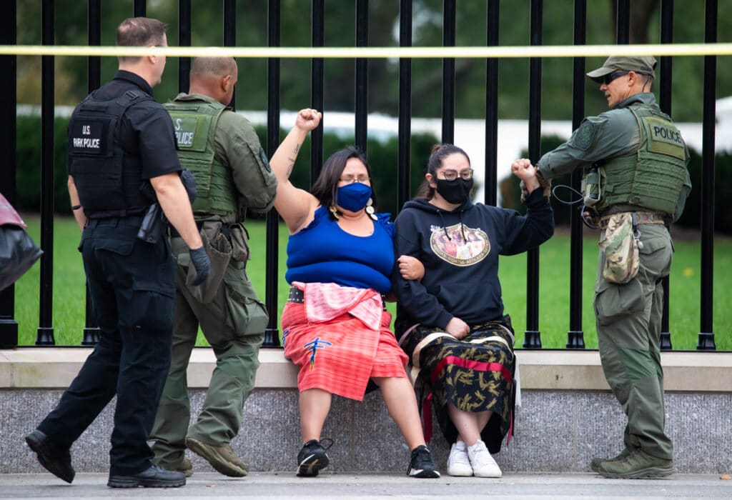Indigenous women being arrested by Park Police by White House