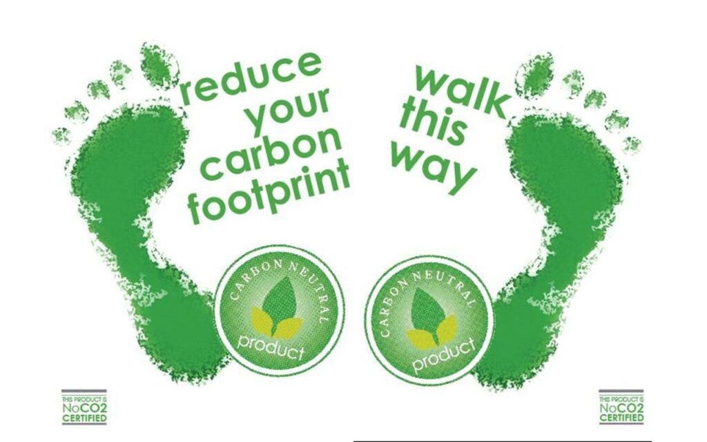 Green footprints with 'reduce your carbon footprint - walk this way'