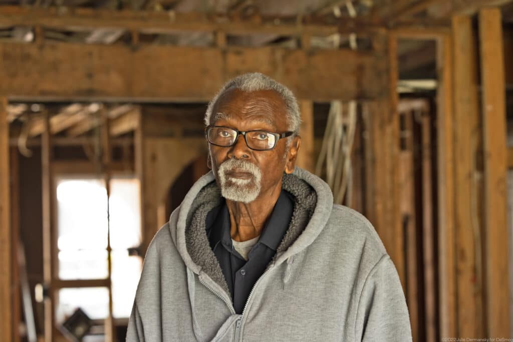 Robert Taylor inside his gutted home that he plans to fix despite not having the funds to do so. Credit: Julie Dermansky