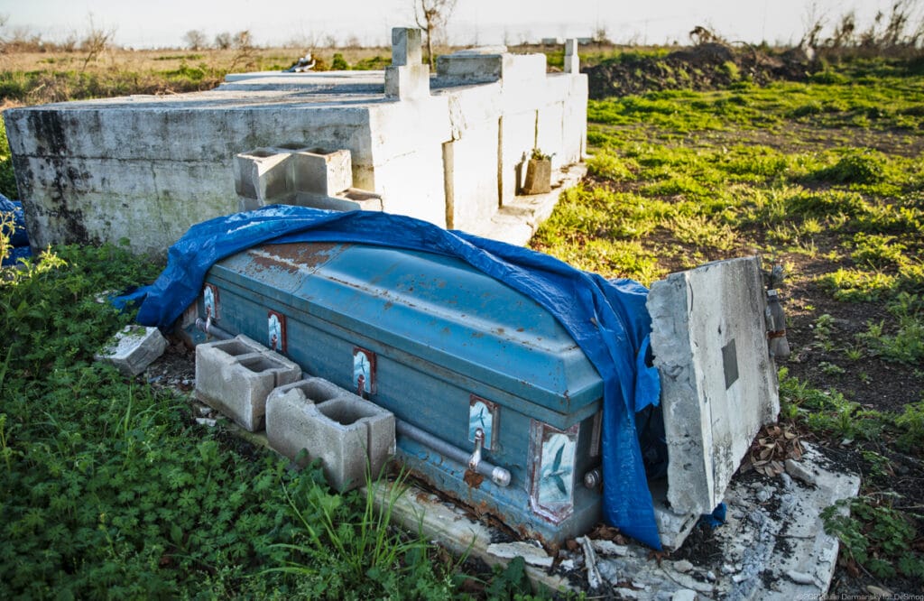Coffin dislodged from a tomb in a cemetery in Ironton on February 27. Credit: Julie Dermansky