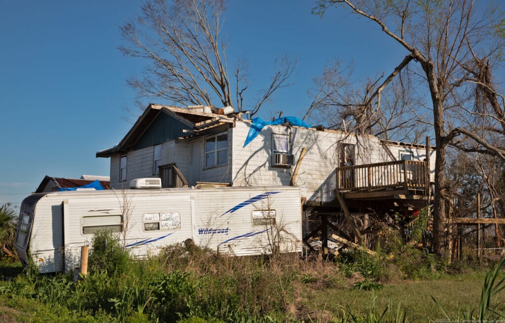 Temporary shelter next to a home damaged by Hurricane Ida in Terrebonne Parish on March 3. Credit: Julie Dermansky