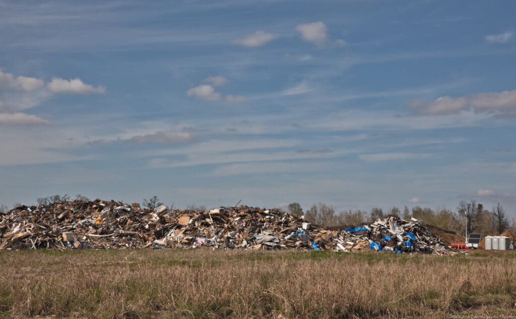 The temporary dump site near Parfait-Dardar's new home. Credit: Julie Dermansky