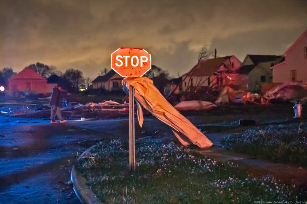 Metal wrapped around a stop sign in Arabi, lit up by a first responder’s headlights on March 22.