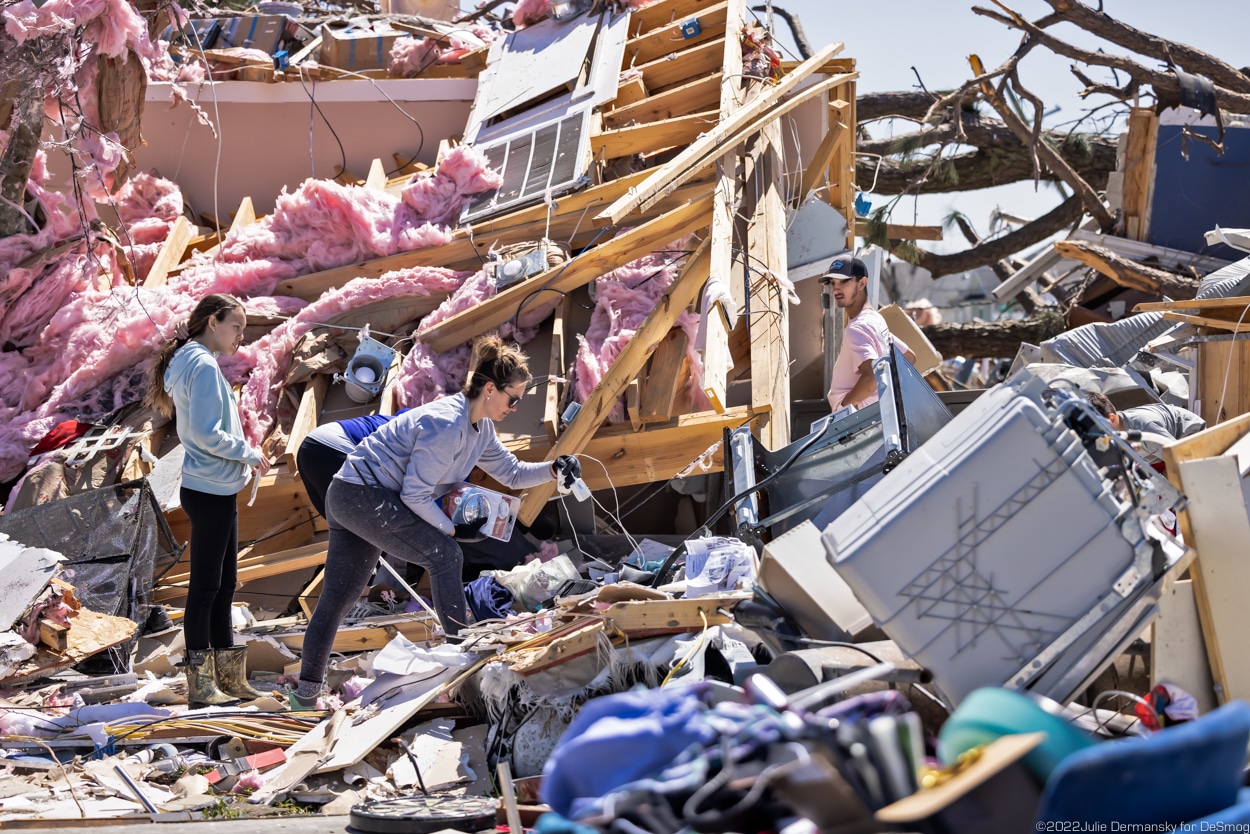 The Dickinson and DeJean families recover what they can from their destroyed property