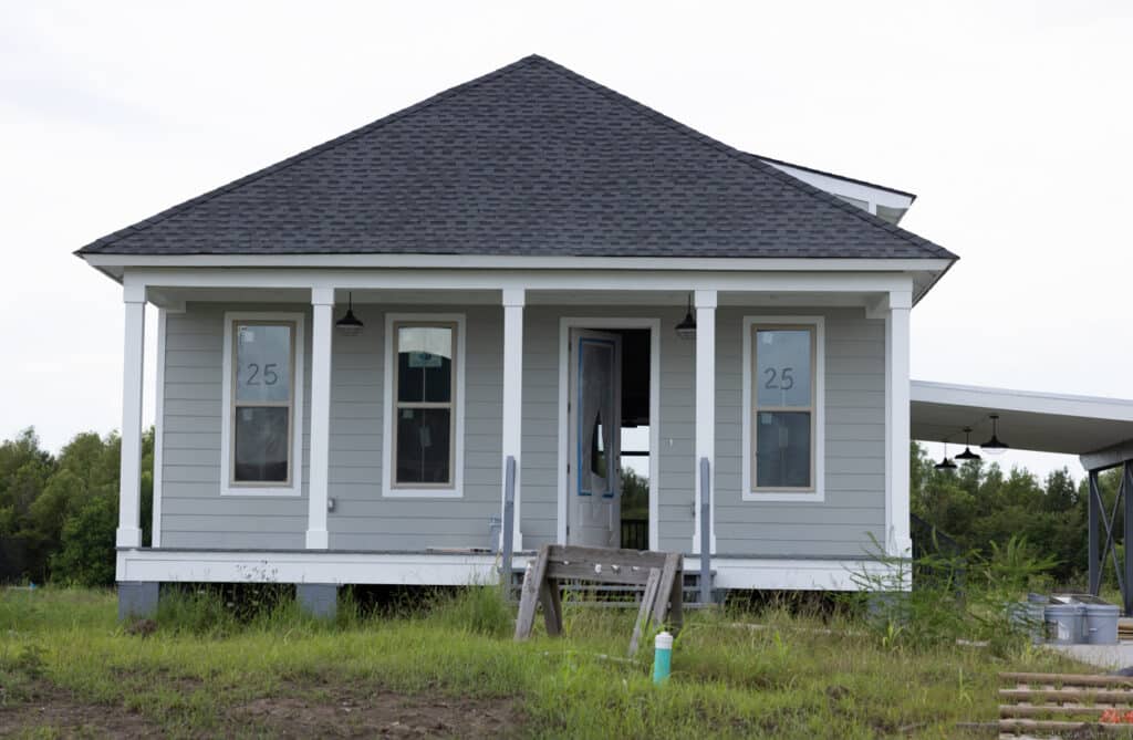 An unfinished house at the New Isle on August 6 with an open door.