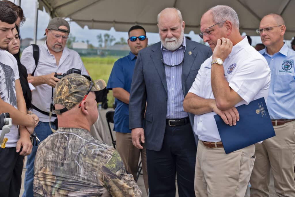 Gov. Edwards talking to Chris Brunet after the press conference on August 24.