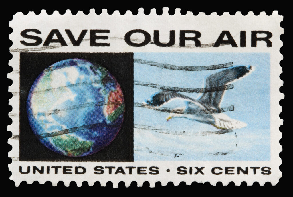A 1970 issued 6 cent United States postage stamp showing Save Our Air with images of the Earth and a seagull flying