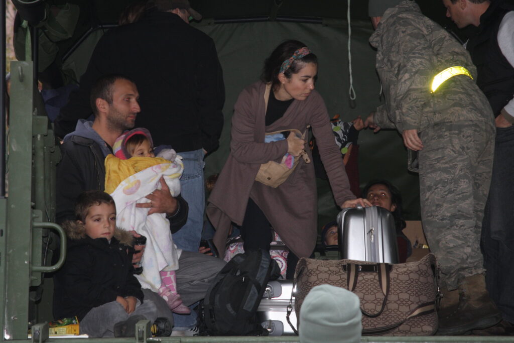 New Jersey National Guard assisted displaced residents in Hoboken, inside an army truck, in the wake of Hurricane Sandy.