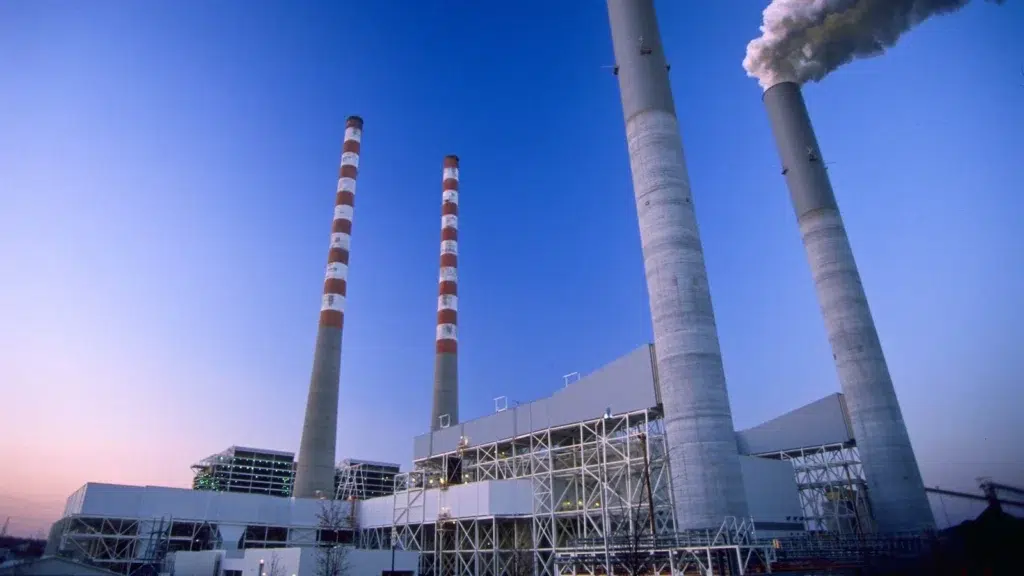 External view of a power plant against a blue sky.