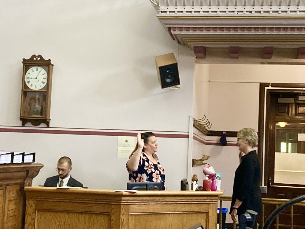 Montana climate scientist cathy whitlock is sworn in to testify in a Montana courtroom.