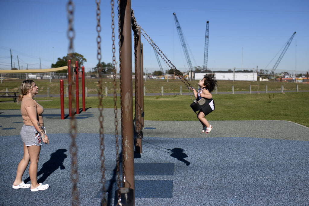 A child and their mother swing on a playground at River Terrace Park in Channelview, TX, U.S., on Wednesday, December 6, 2023. 

Photographer: Mark Felix