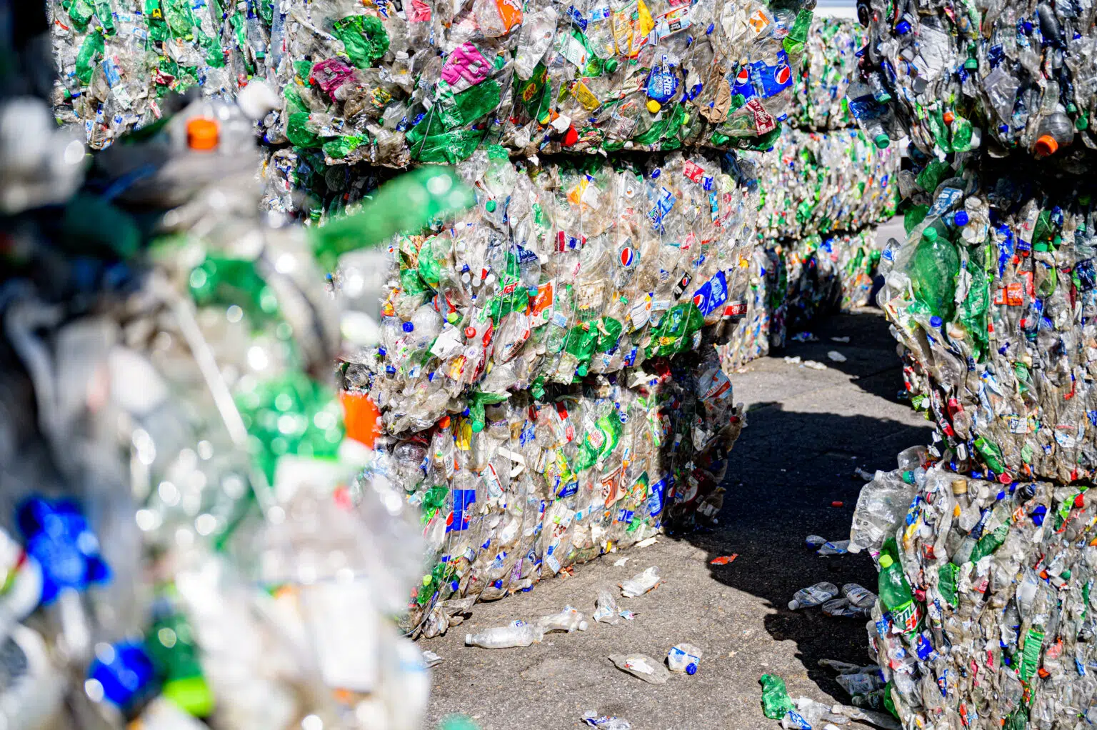Stacks of plastic bottles at a recycling plant