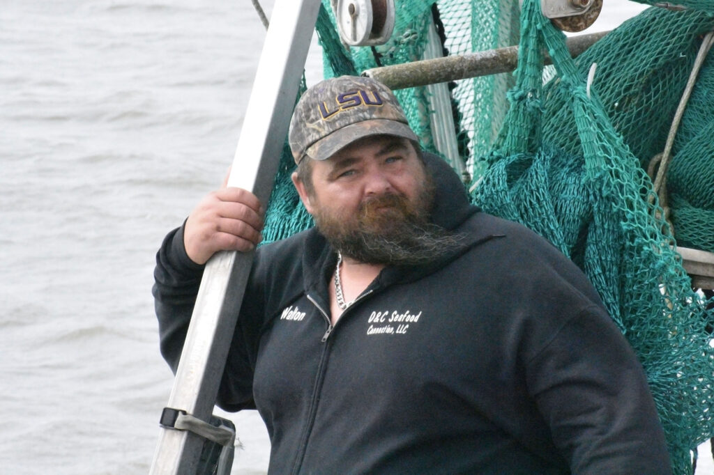 Travis Dardar, a local fisherman and opponent of Louisiana LNG expansion, on his boat.