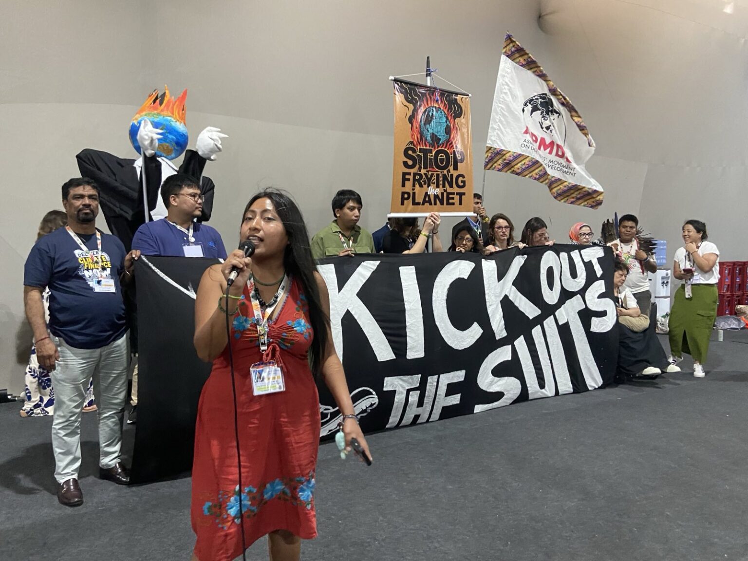 Activists protest the presence of agribusiness groups at the COP30 summit in Belem, Brazil.