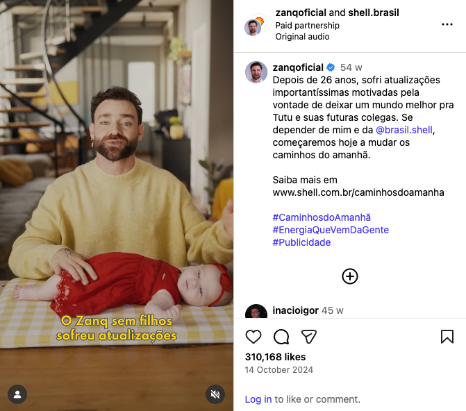 A paid partnership Instagram post in Shell's Paths of Tomorrow campaign. It shows a photo of a happy looking man in a modern home, changing his baby's diaper, and includes a positive message about Shell related to clean energy.
