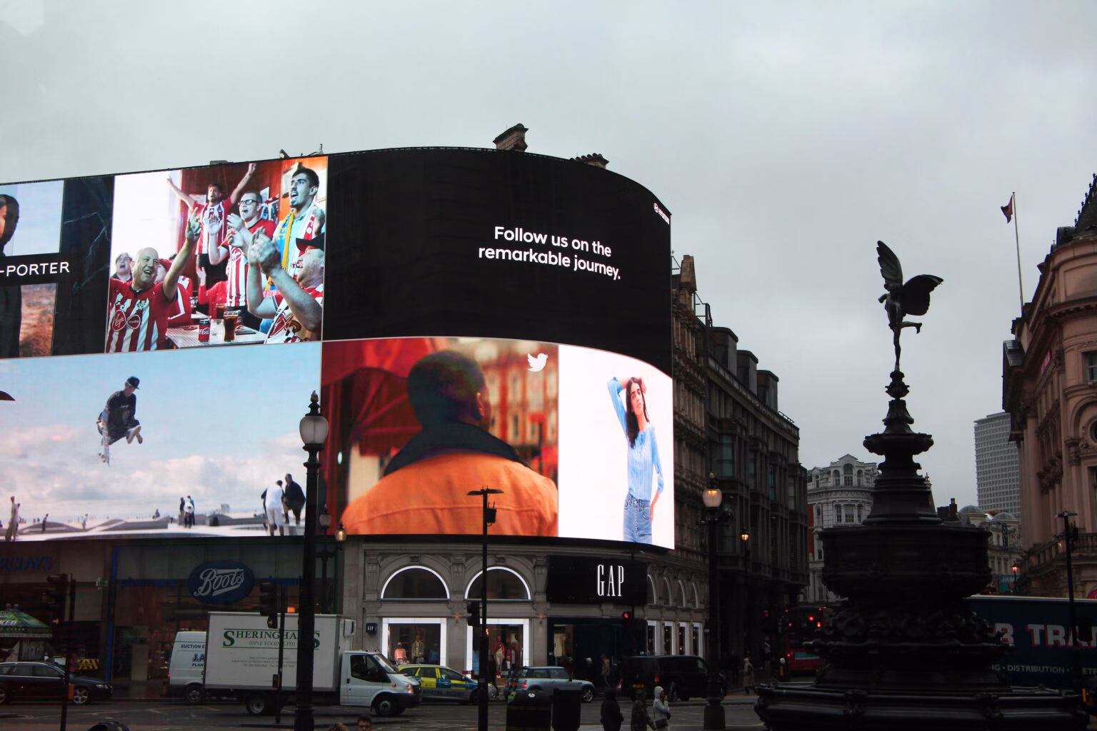 Digital advertising billboards tower over London's Picadilly Circus.