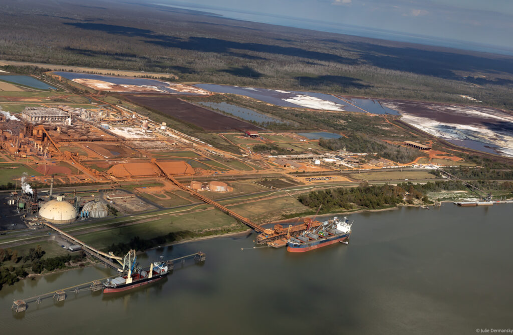 The Atalco alumina refinery on the banks of the Mississippi River, with ships loading.