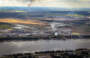 Mosaic Company’s Faustina Ammonia Plant and CF Industries' Donaldsonville Complex's port in the 5th District of St. James with smoke rising from burning sugarcane fields