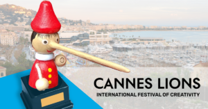 An illustration featuring a prize that's shaped like a long-nosed Pinocchio. His nose is hovering above the words Cannes Lions International Festival of Creativity.