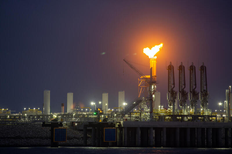 Flaring of methane from the Venture Global Calcasieu Pass LNG facility is visible for miles in the night sky.