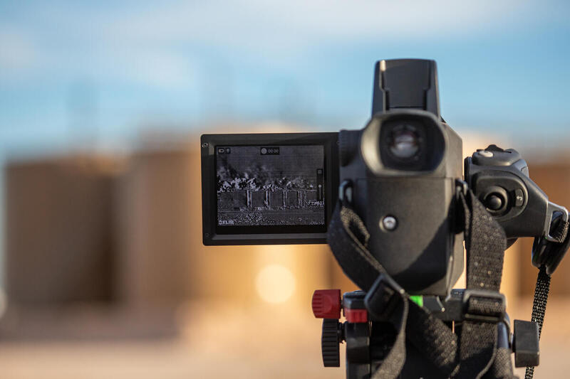 FLIR camera used to detect methane leaks is pointed at oil and gas storage tanks in Pecos, Texas.