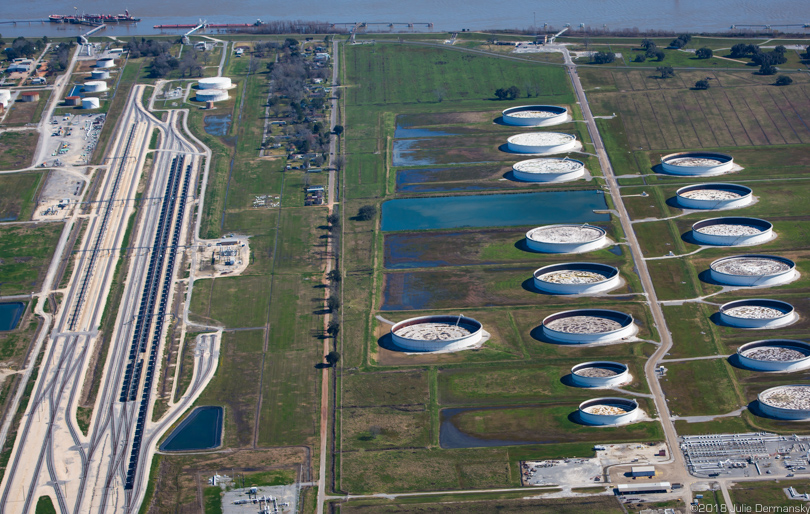 Aerial view of the neighborhood around Burton Street in St. James, surrounded by oil tanks and a railroad terminal