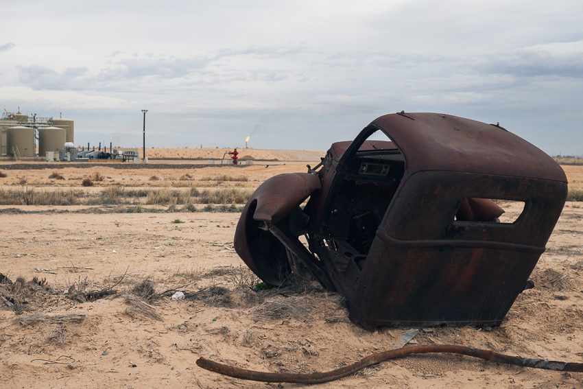 Rusted out truck cab at an oilfield site in the Permian Basin