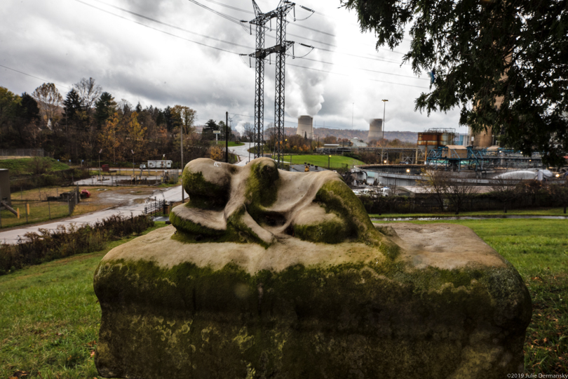 Resting angel on tombstone in Pennsylvania next to the now-closed Bruce Mansfield coal plant.