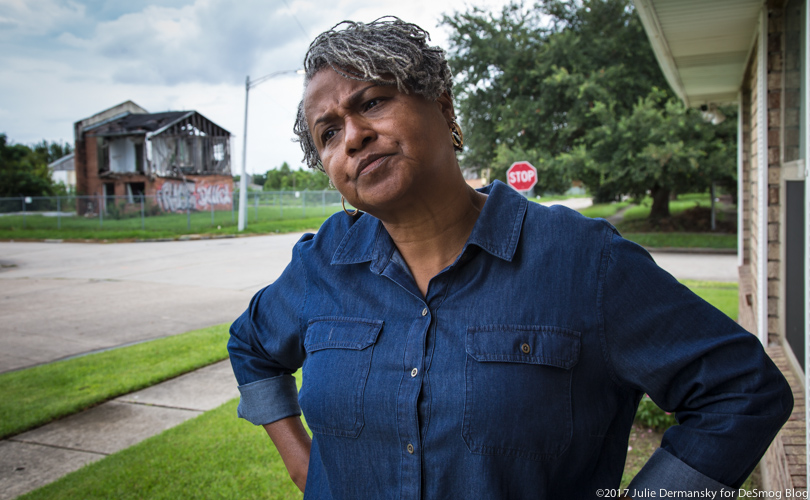 Shannon Rainey stands across from Katrina-damaged homes in New Orleans' Upper Ninth Ward