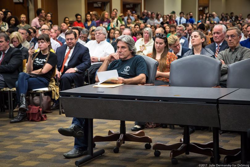 Atchafalaya Basinkeeper Executive Director Dean Wilson prepares to testify at a crowded permit hearing