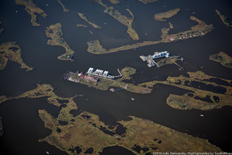 Industrial buildings line the fragile coast of Plaquemines Parish.