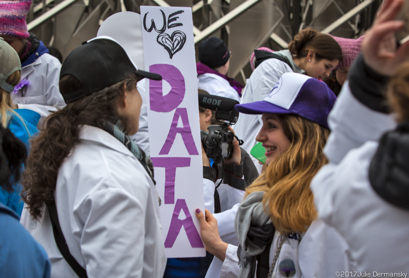 Women scientists hold a 'We heart data' sign ahead of the Women's March.