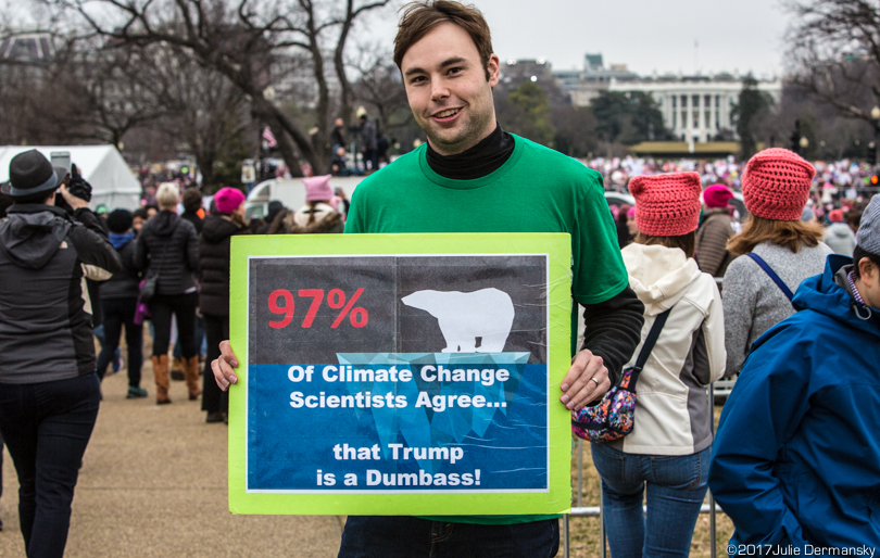 An aerospace engineer holds his pro-science, anti-Trump protest sign in front of the White House