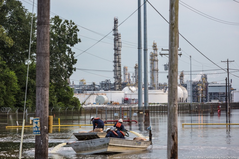 Workers dump soda ash in floodwaters at a chemical plant in Louisiana.