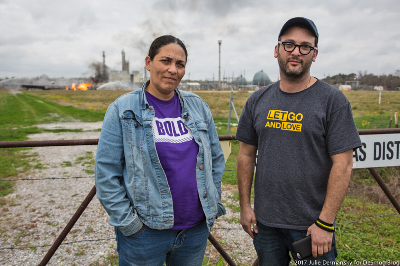 Cherri Foytlin and Josh Fox stand in front of the fire raging at the Phillips 66 natural gas pipeline explosion site