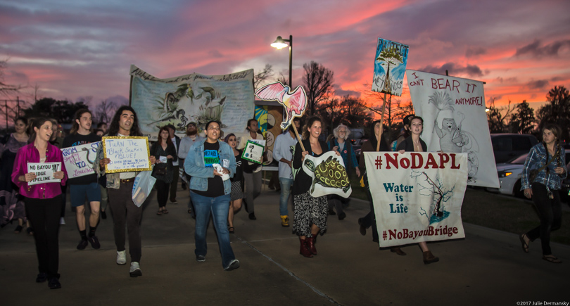 Bayou Bridge pipeline protesters march with signs