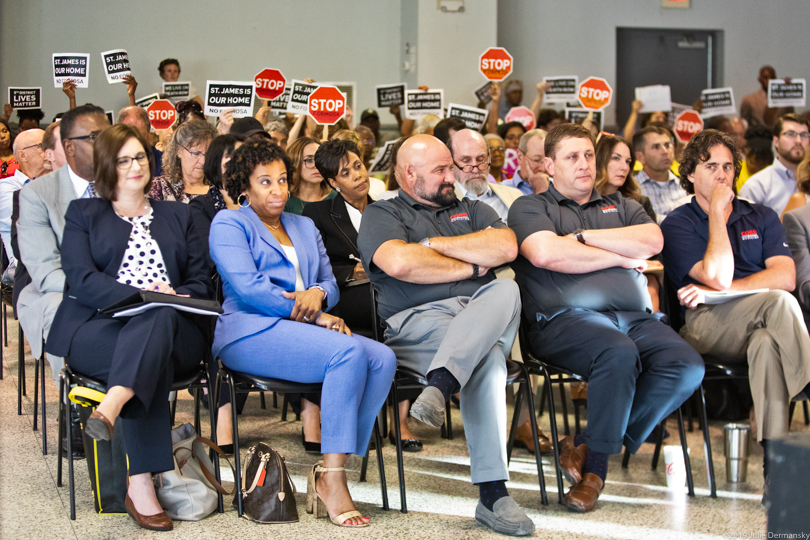 Activists holding signs at an LDEQ hearing about Formosa's proposed petrochemical plant in St. James Parish