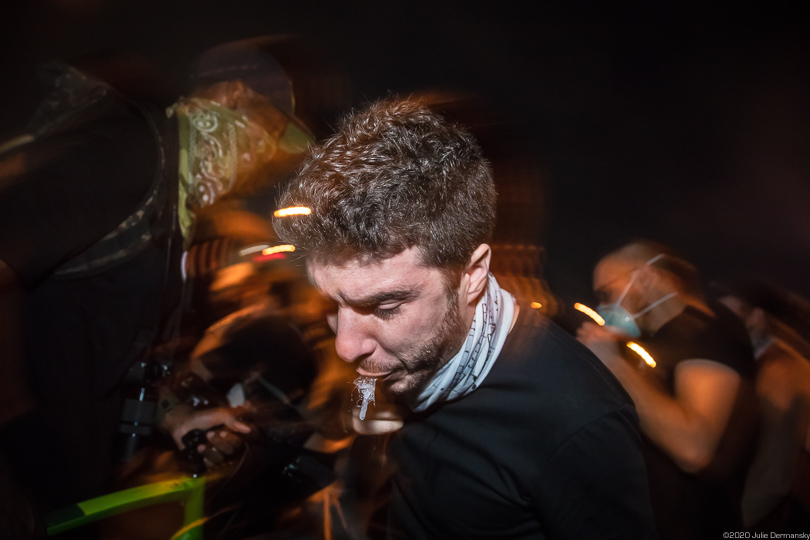 Protester reacting to tear gas fired by police in New Orleans June 3