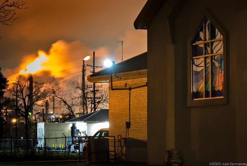 Flares at ExxonMobil's Baton Rouge refinery complex seen from the Star of Bethlehem Baptist Church's parking lot.