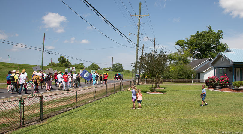 Children watch the Coalition Against Death Alley march