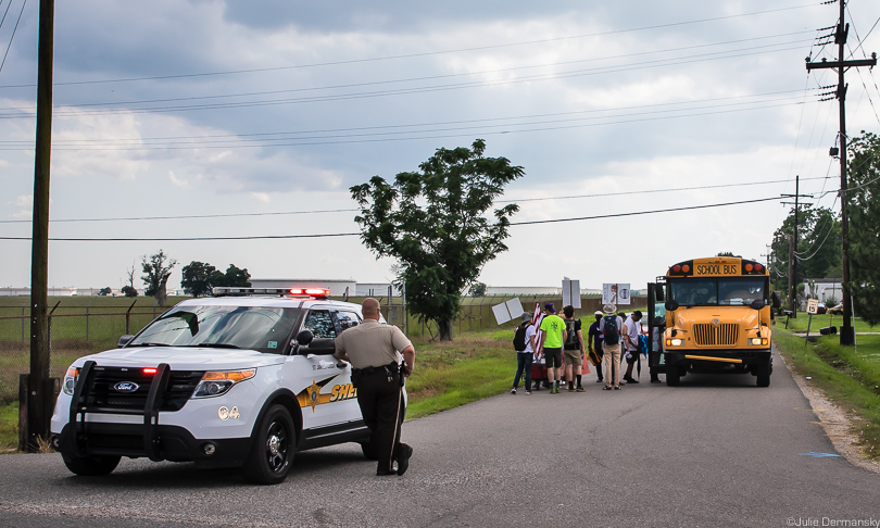 CADA marchers board a bus in St. James