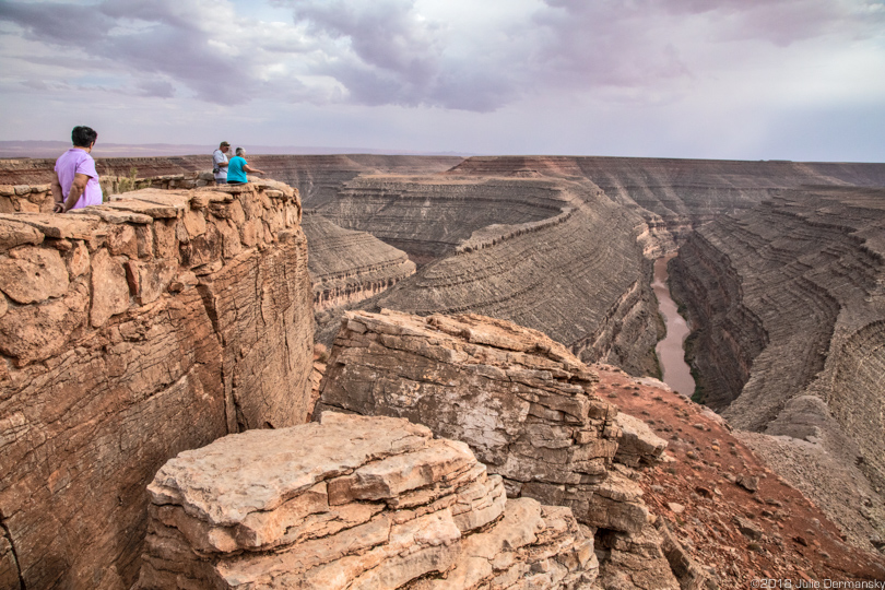 Visitors view Gooseneck Bend in Grand Staircase-Escalante National Monument