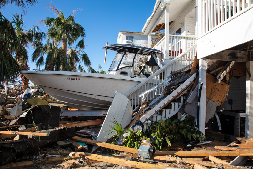 Boat in between homes in Mexico Beach after Hurricane Michael