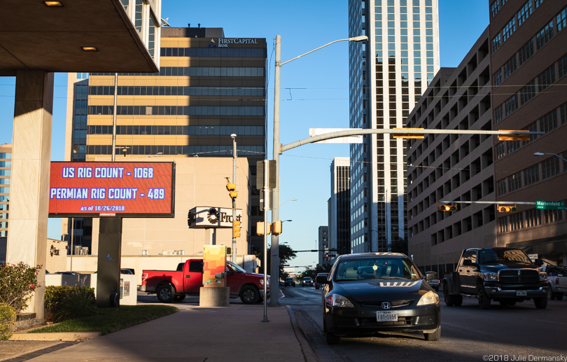 LED sign counting the number of oil rigs in the US and Permian Basin